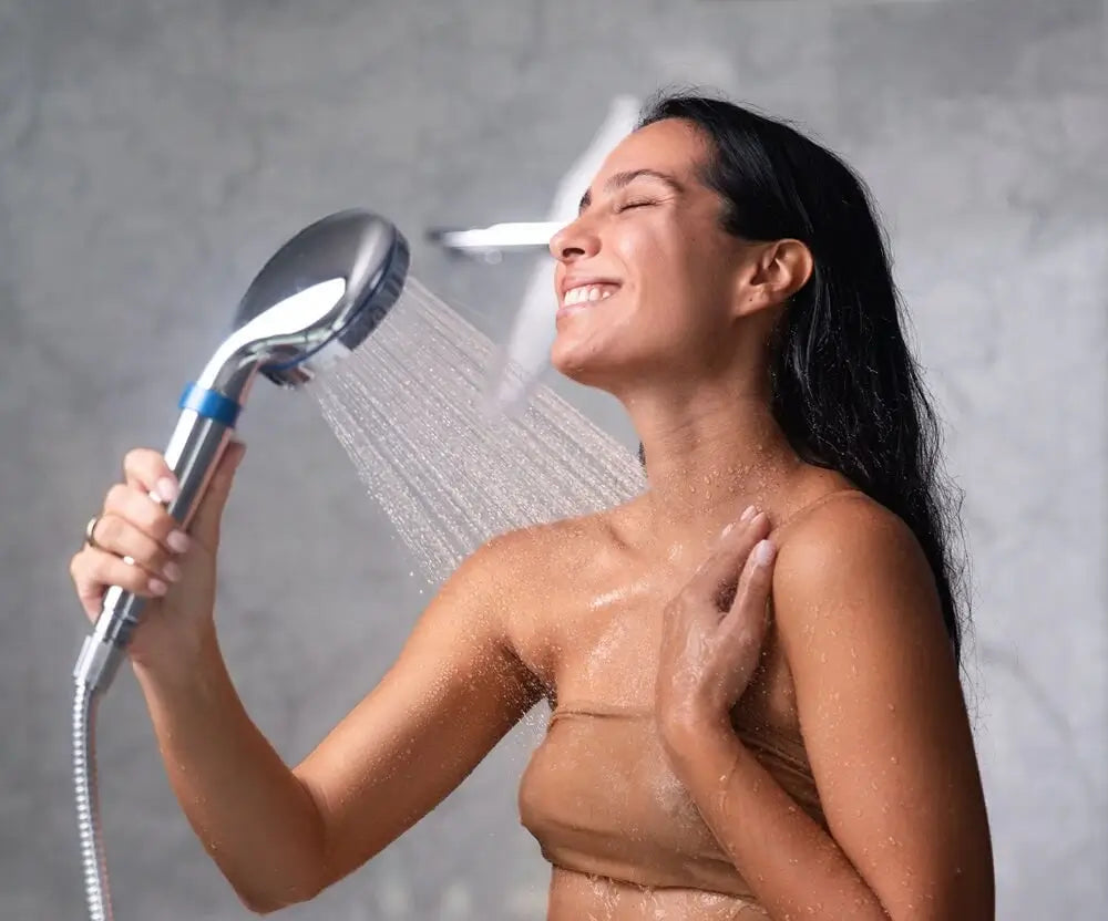 Female enjoying the blu Ionic Shower Filter Handheld