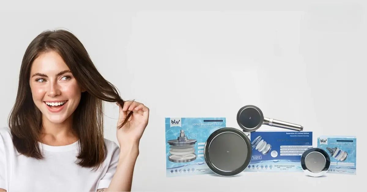 Smiling woman holding her hair, with a range of blu Ionic Shower Filters and packaging displayed