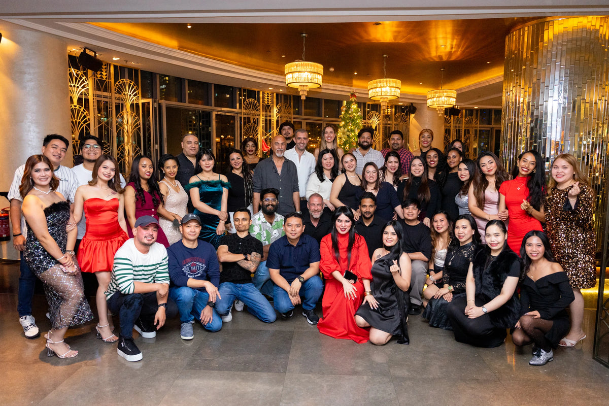 The blu team photographed together at a company gathering in Dubai.